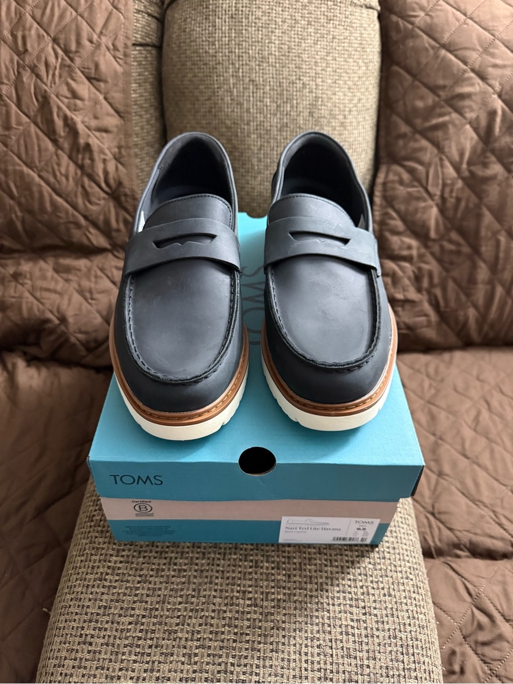 TOMS Black Leather Penny Loafers with Tan Welt and White Sole